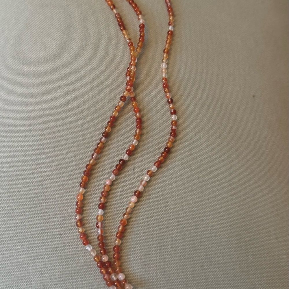 Elegant Beaded strands in Warm Orange Tones